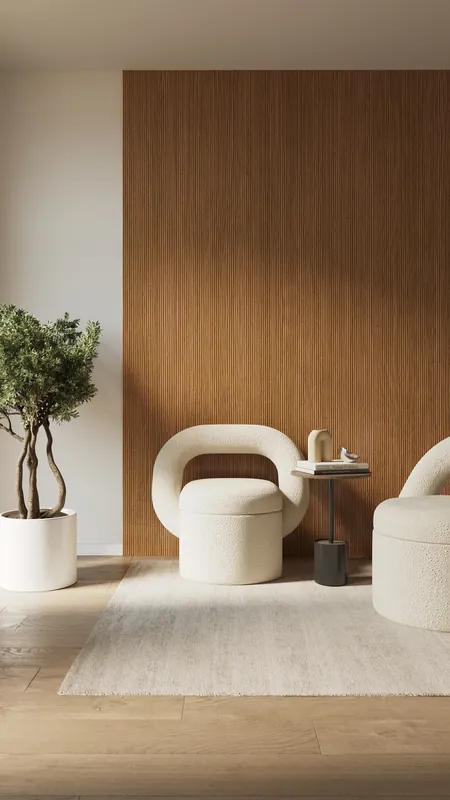 Armchairs and plant in front of an oak fluted wall