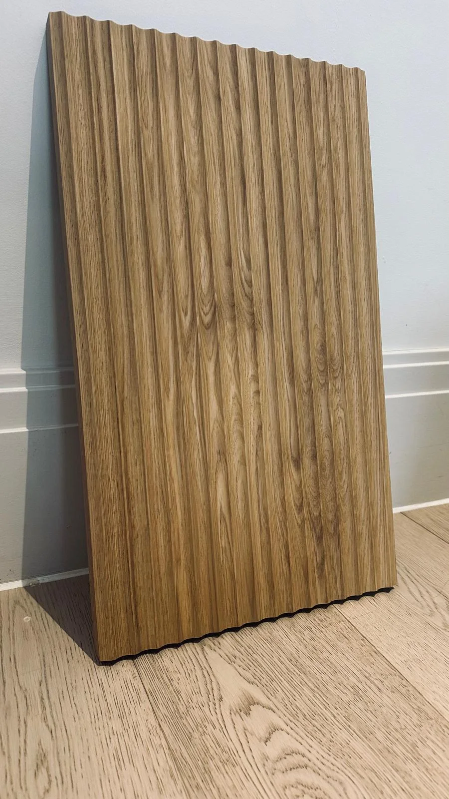 European oak fluted wood panel showing real timber grain and machined grooves