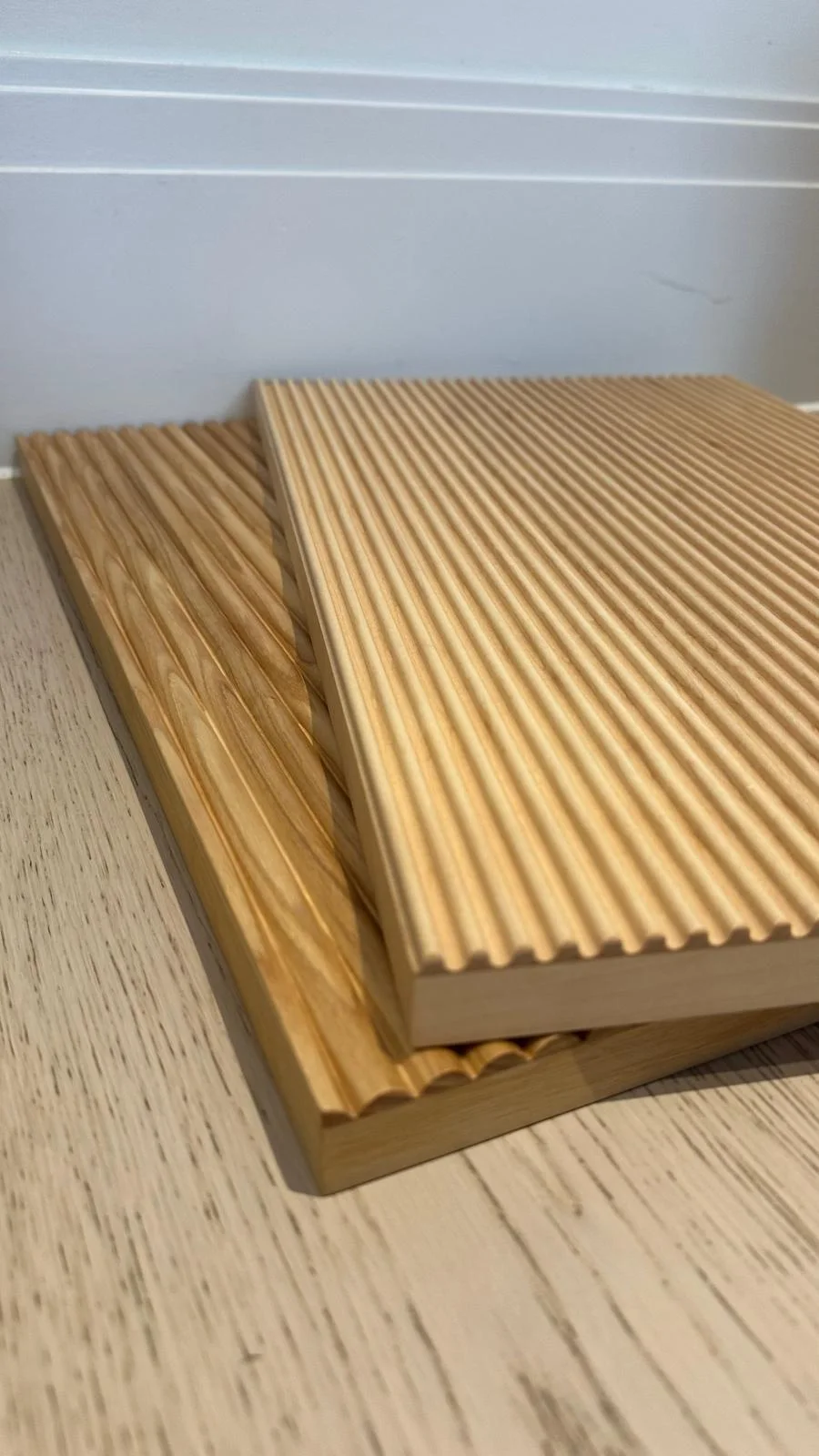 Close-up of European oak fluted panel showing linear grooves and real grain