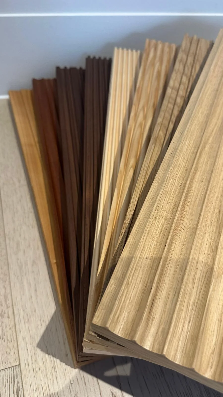 Selection of real timber veneer leaves in oak and darker species for panel specification